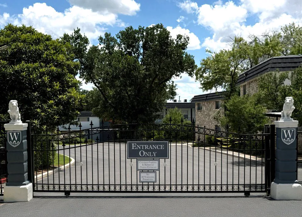 Gated entrance at Wilshire Woods Apartments