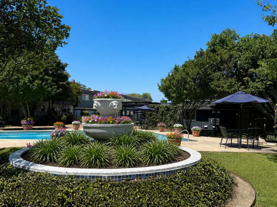 Ornamental fountain beside the swimming pool at Wilshire Woods Apartments